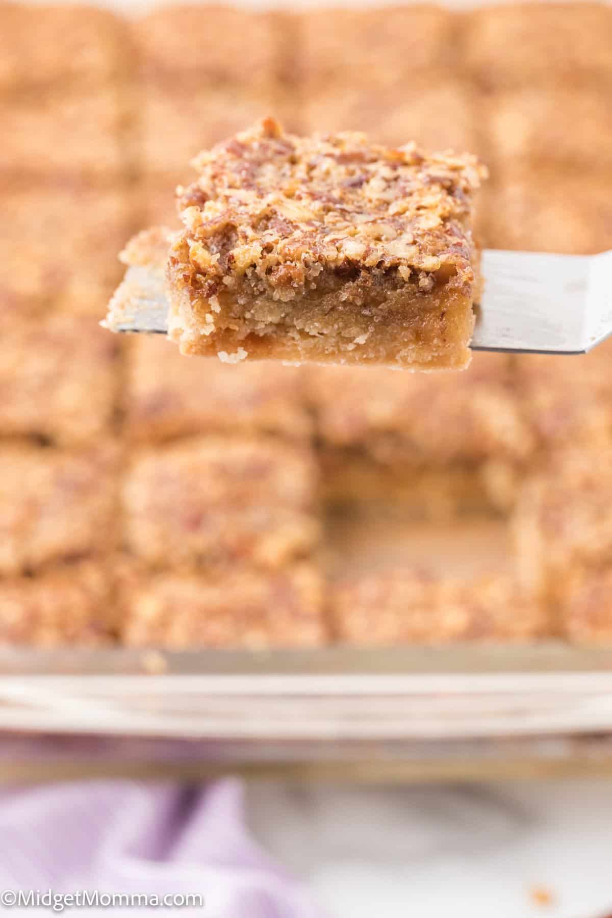 Pecan Pie Bars on a serving utensil