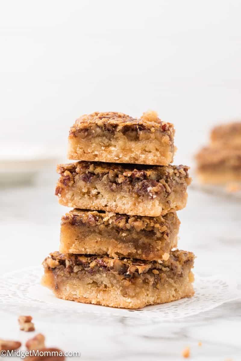 Stack of pecan pie dessert bars on a plate