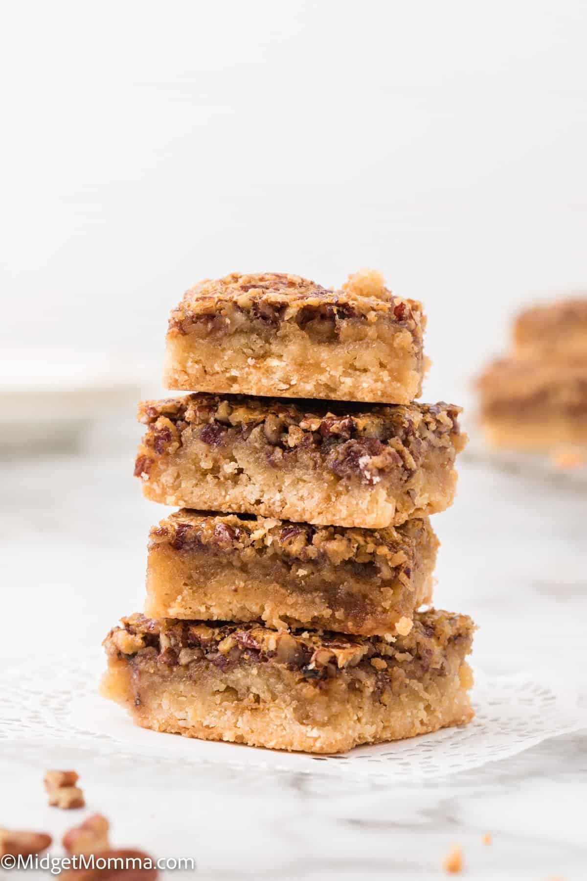 Stack of pecan pie dessert bars on a plate