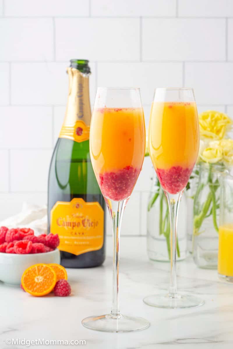 Raspberry Mimosa Drink in a champagne flute