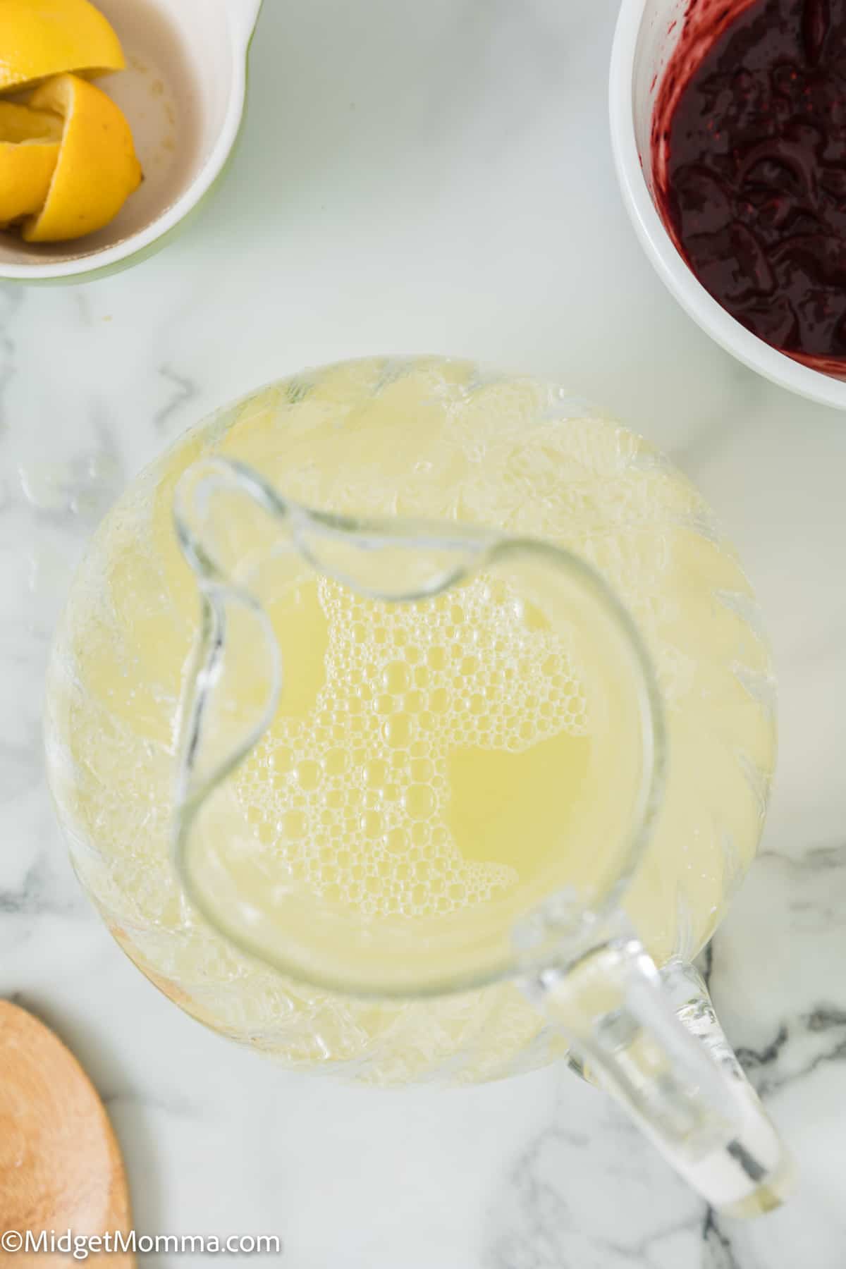 lemon juice and water combined in a pitcher 