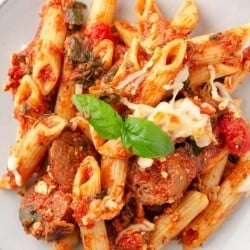 close up photo of baked penne pasta on a plate