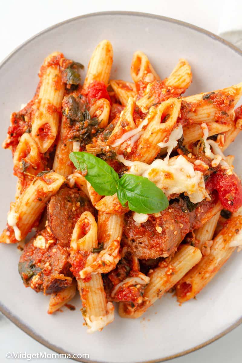 close up photo of baked penne pasta on a plate