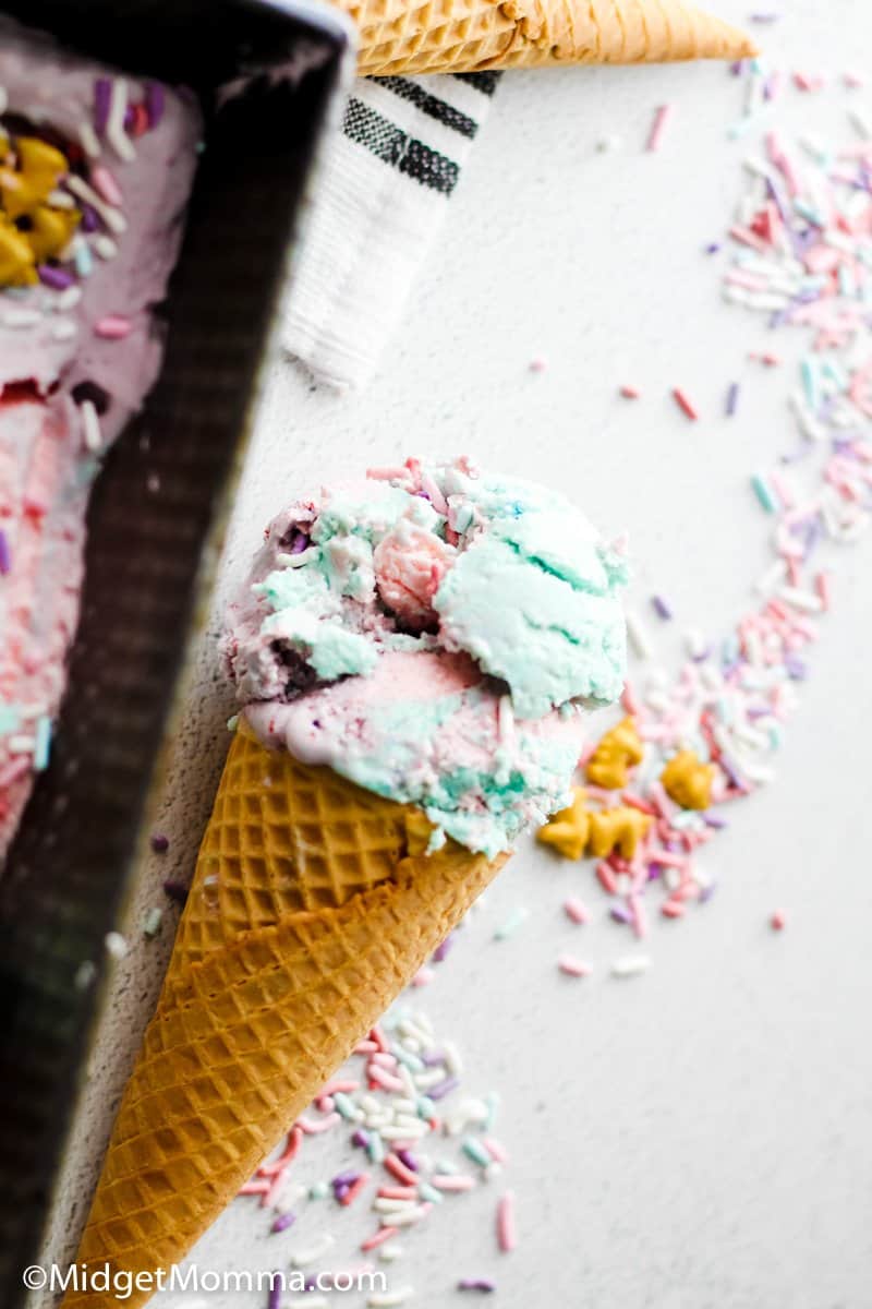 close up photo of unicorn ice cream in a cone