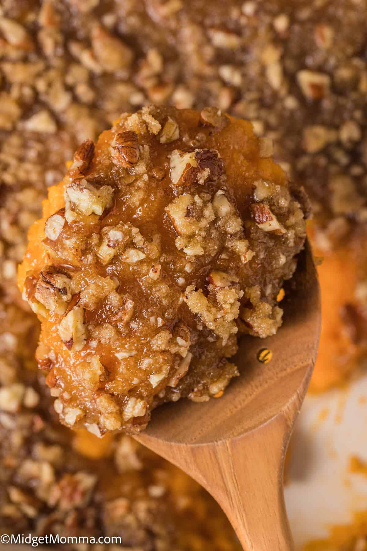 large spoonful of Sweet Potato Casserole with Pecan Topping Recipe