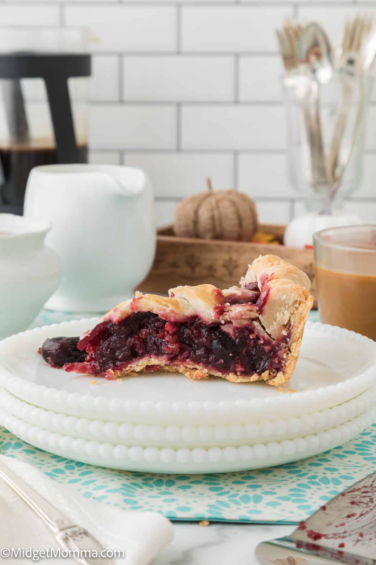 side view of cherry pie on a plate