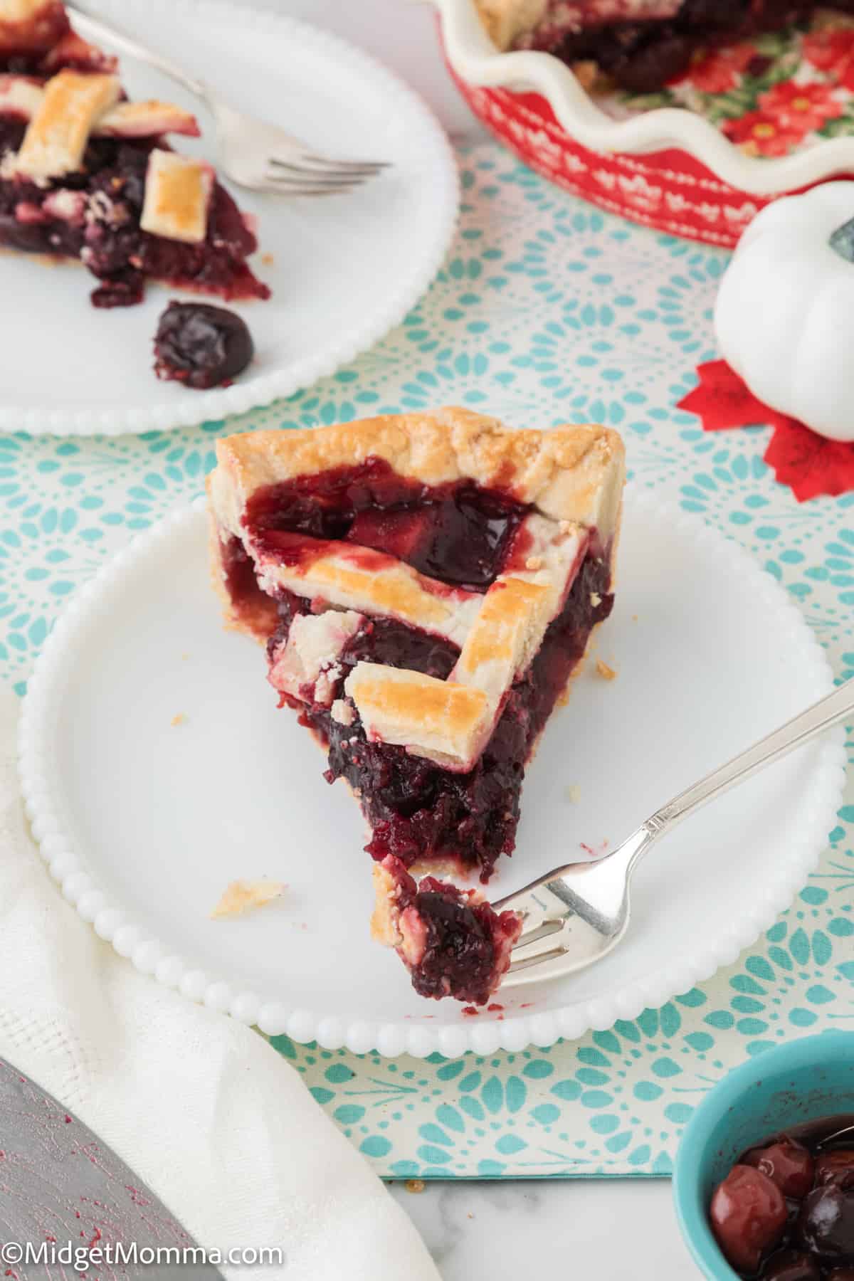 slice pf cherry pie on a plate