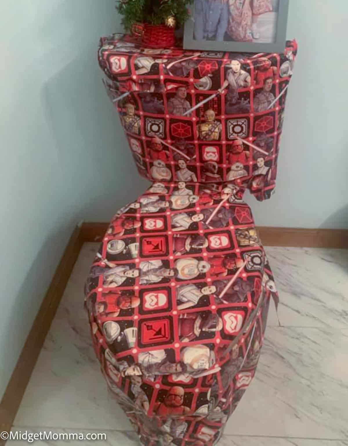 toilet wrapped in wrapping paper by elf on the shelf