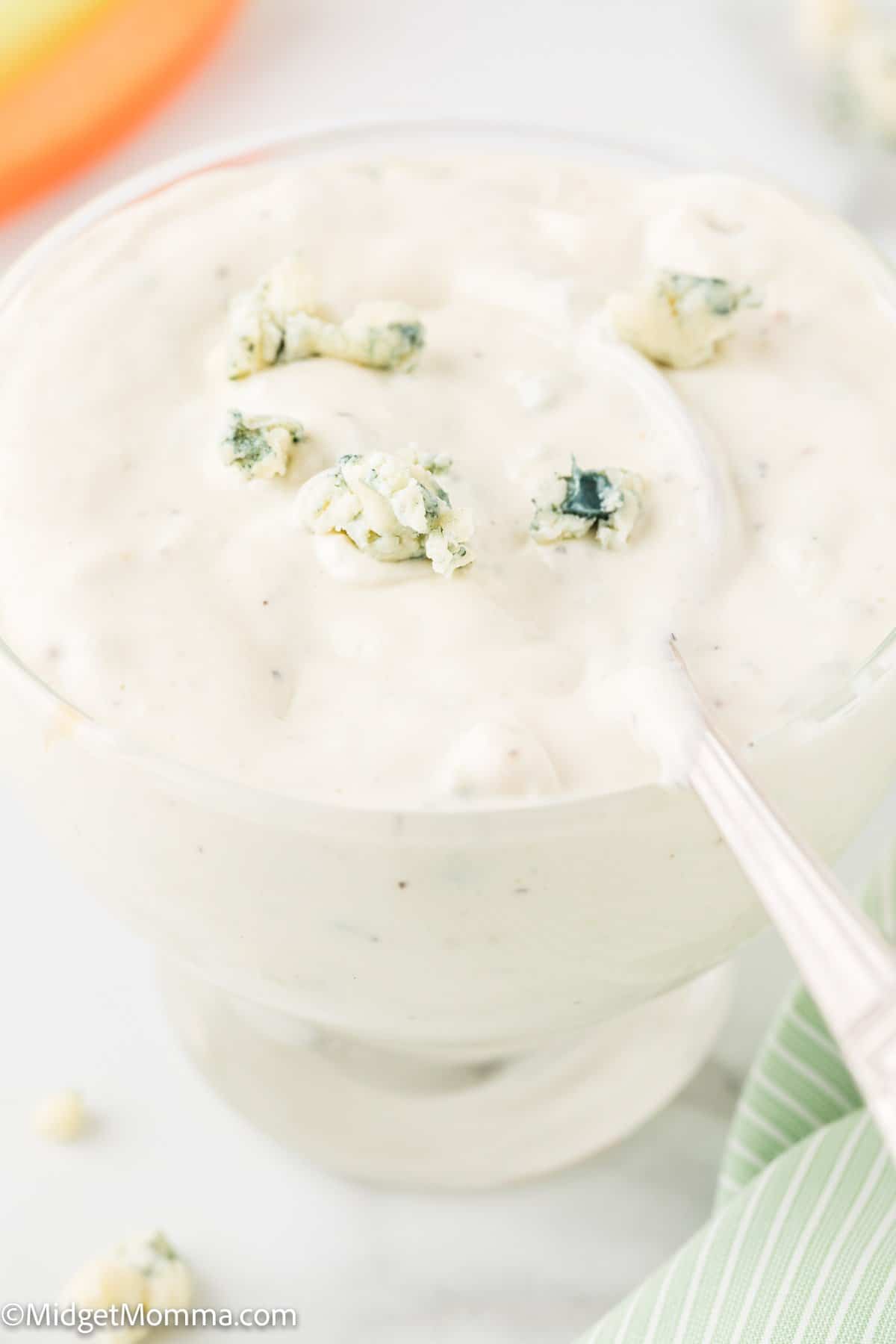 homemade blue cheese dressing recipe in a bowl with a spoon