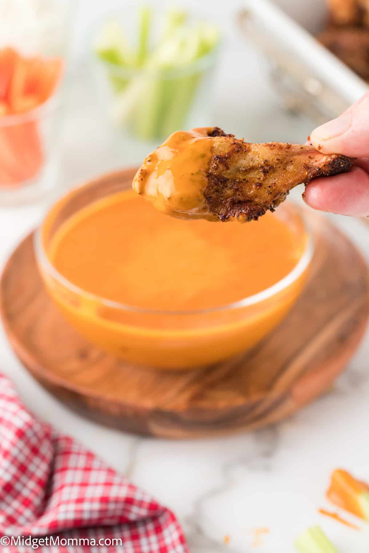 chicken wing coated in homemade buffalo sauce 
