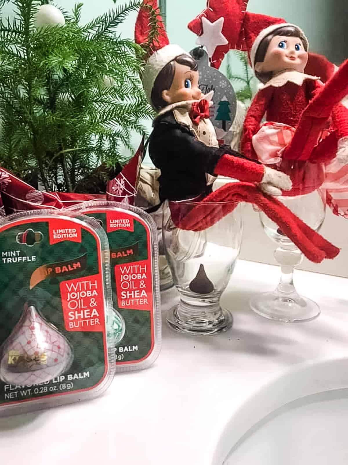 elf on the shelf poops in a cup with a hershey kiss poop