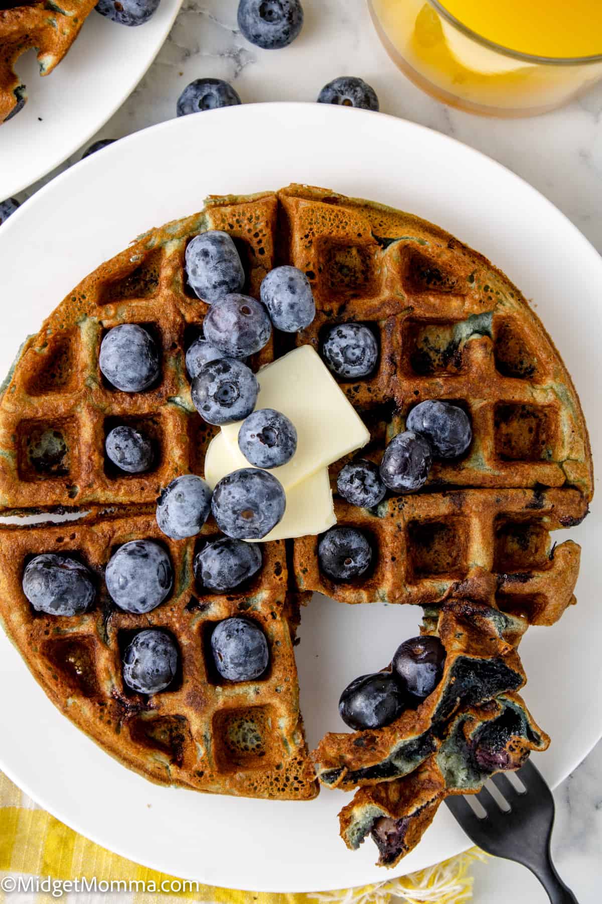 overhead photo of blueberry waffles on a plate