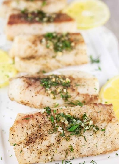 close up photo over air fryer cod fish on a serving dish