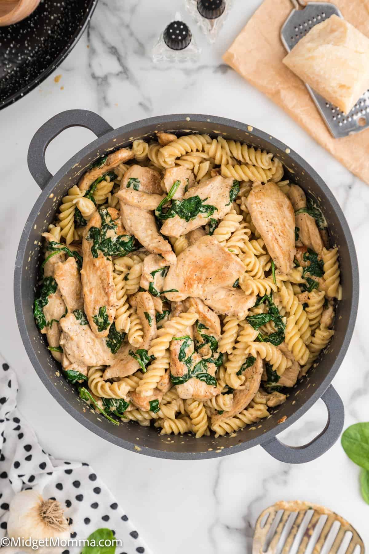 Creamy Garlic chicken pasta with spinach in a large pot