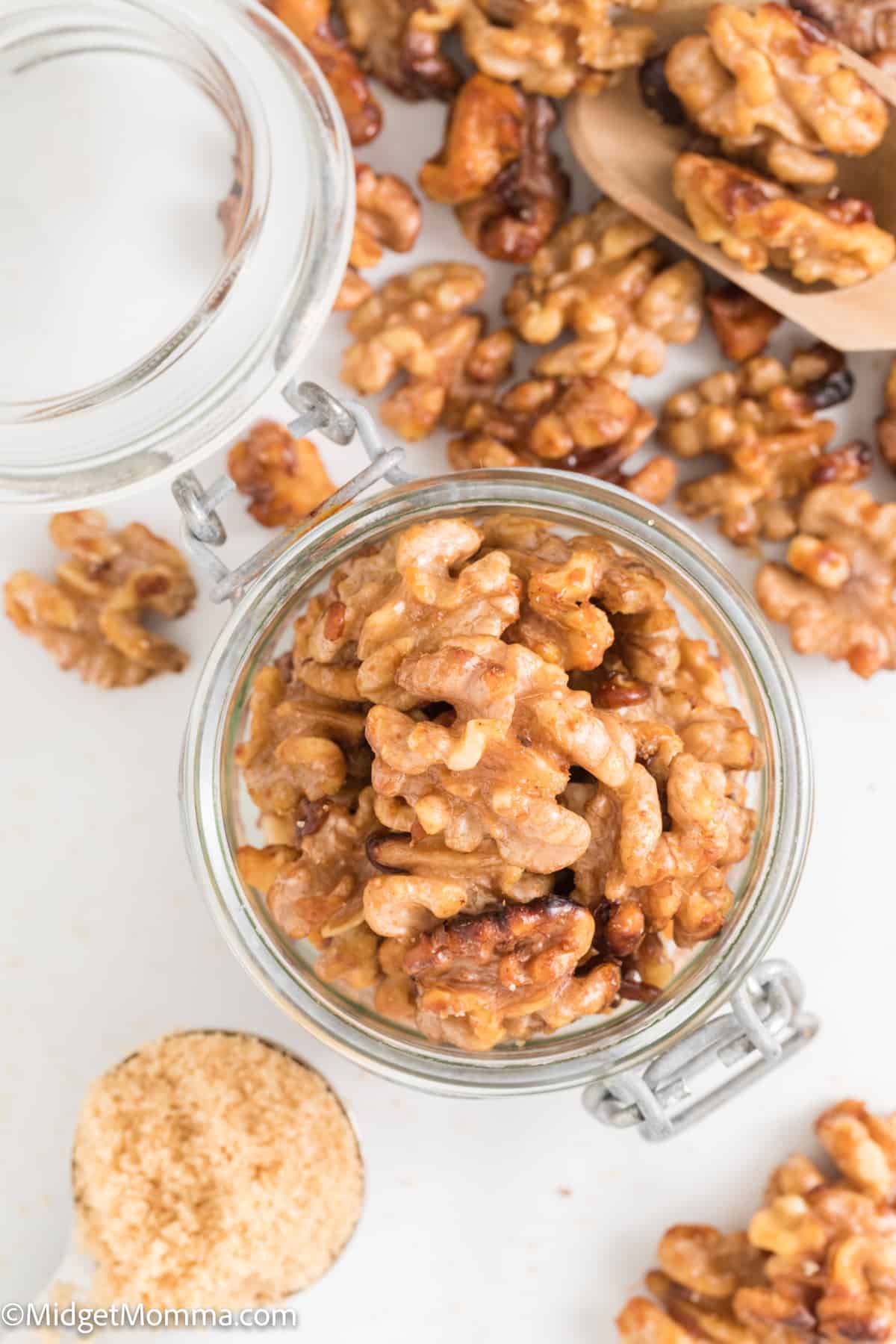 overhead photo of candied walnuts in a glass jar perfect for gifting