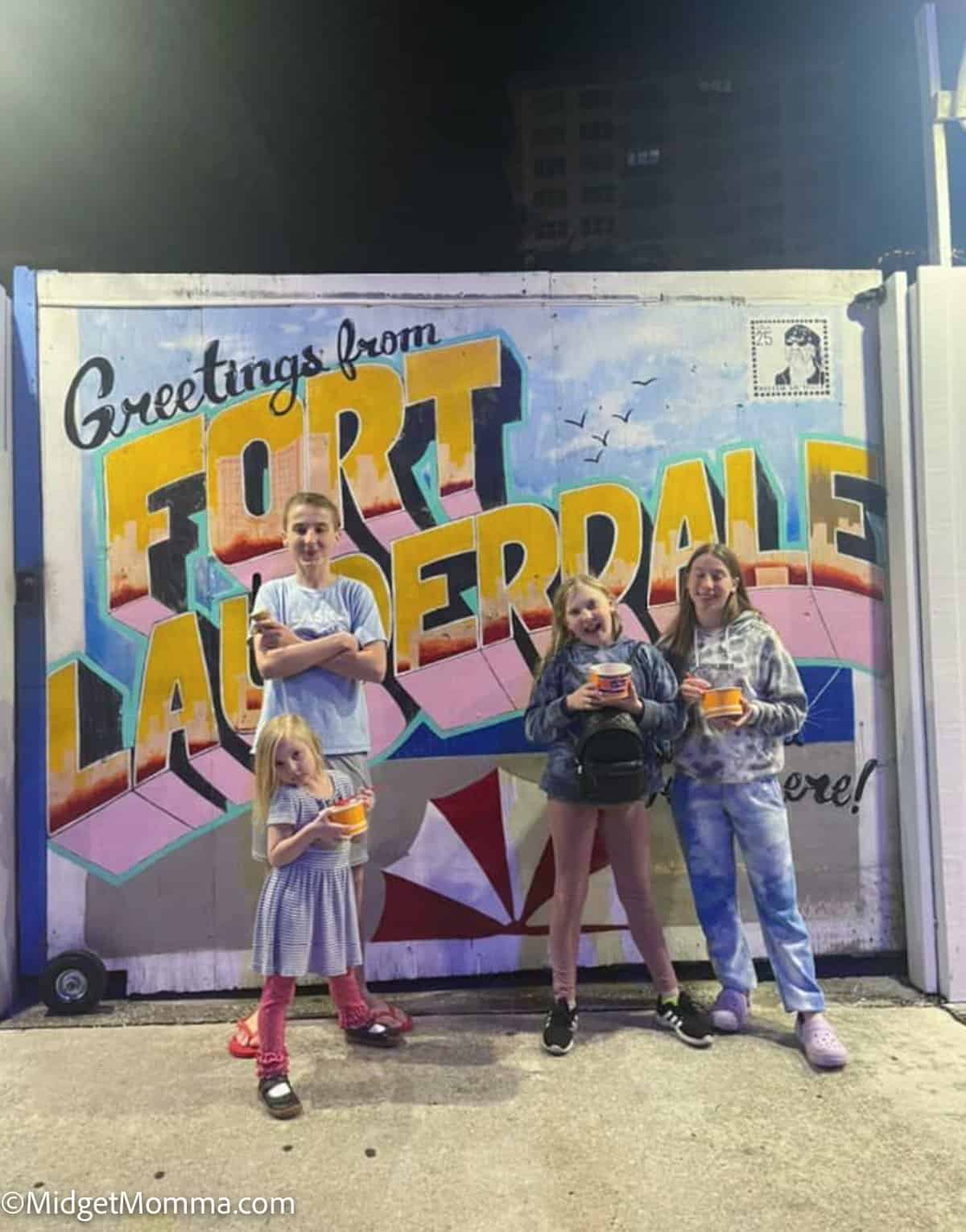 Things to do in Fort Lauderdale Florida - greetings from fortlauderdale sign with kids standing in front of it