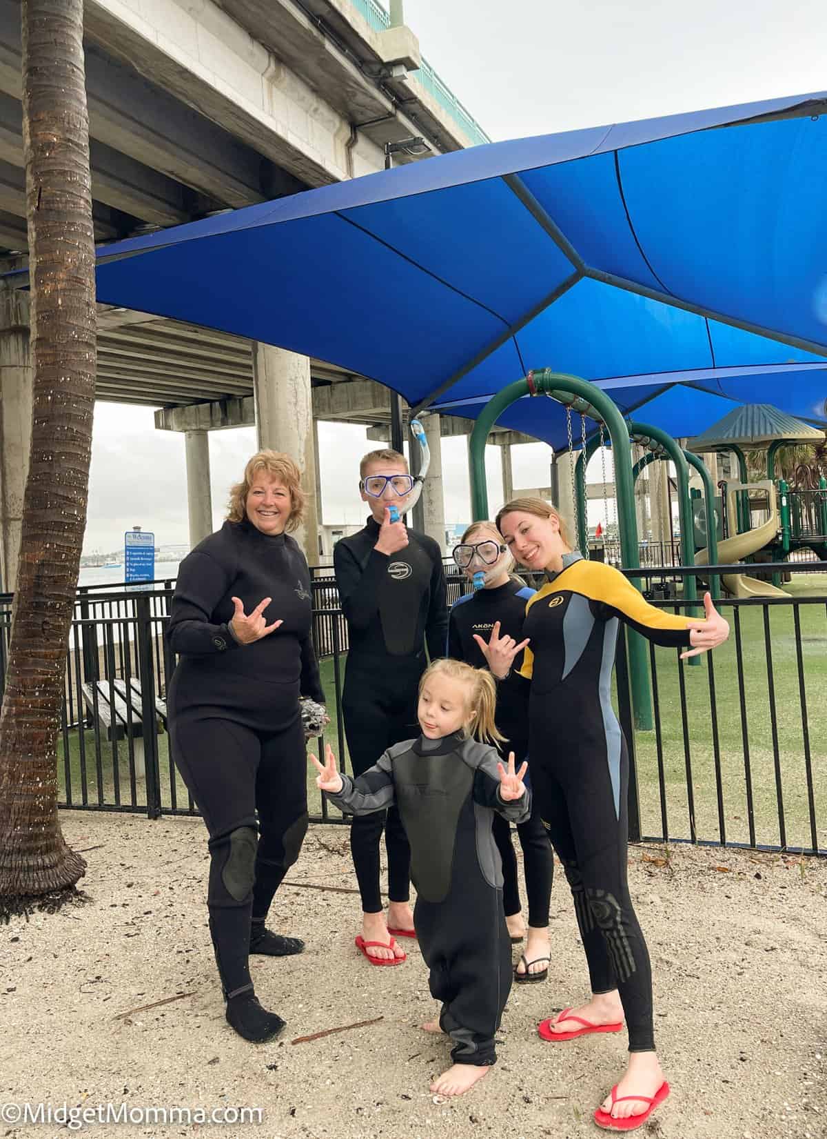 kids snorkeling at Phil foster Park in west palm beach florida - photo with laura parke and kids before getting in the water, while wearing wetsuits