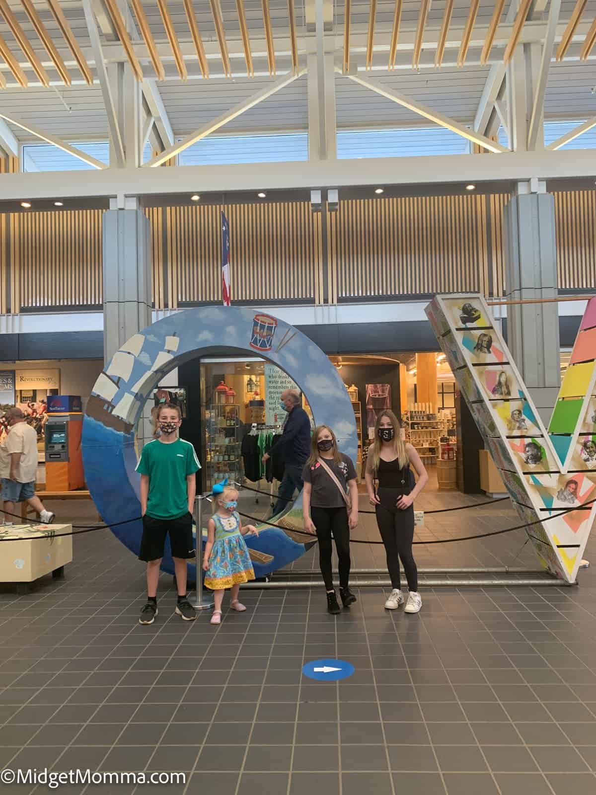 Things to do in Williamsburg Virginia - kids standing in front of the Virginia LOVE sign