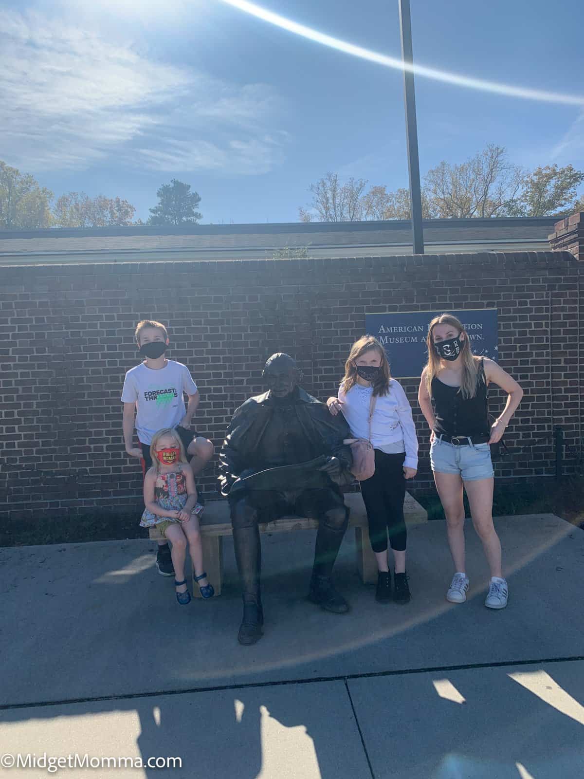 Yorktown Museum in Williamsburg Virginia- kids standing by a statue