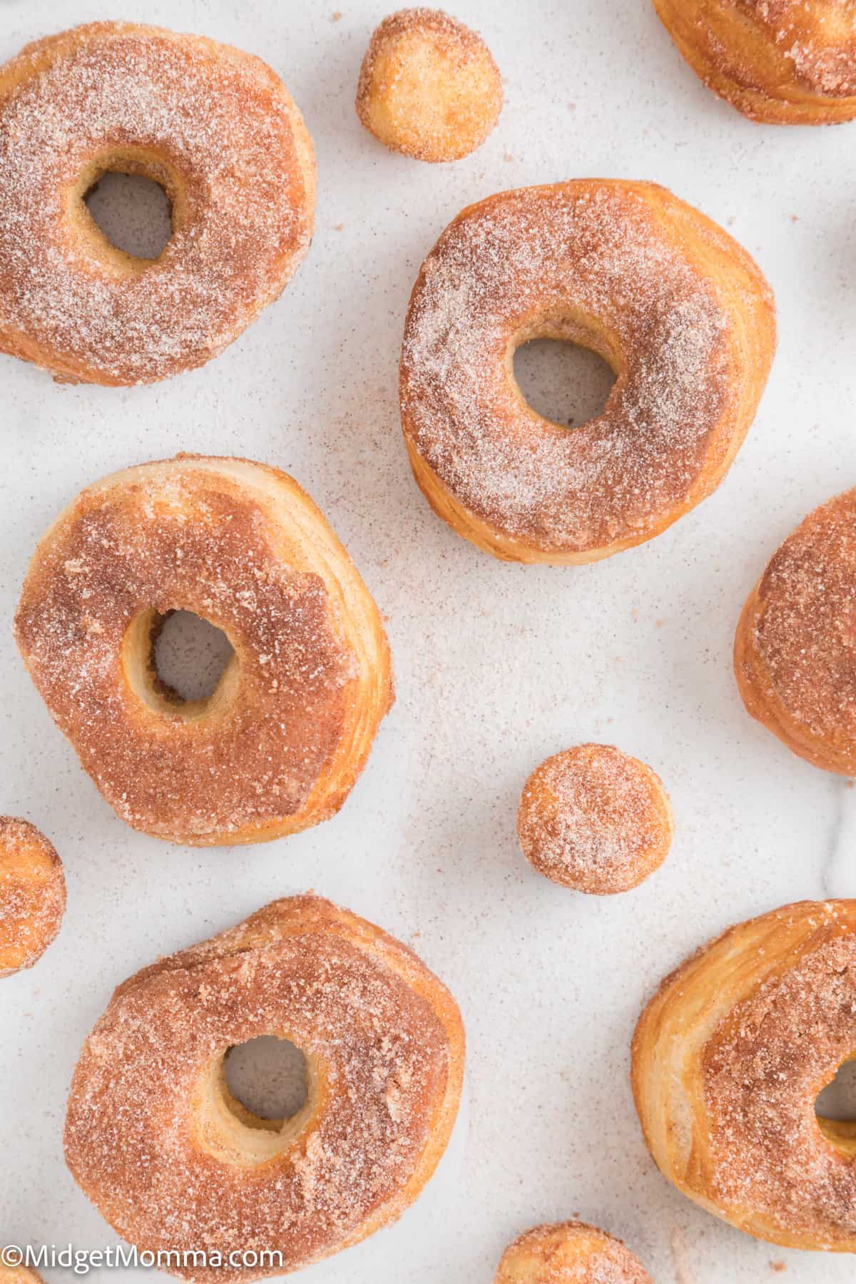 over head photo of Cinnamon Sugar Air Fryer Donuts made with canned biscuits