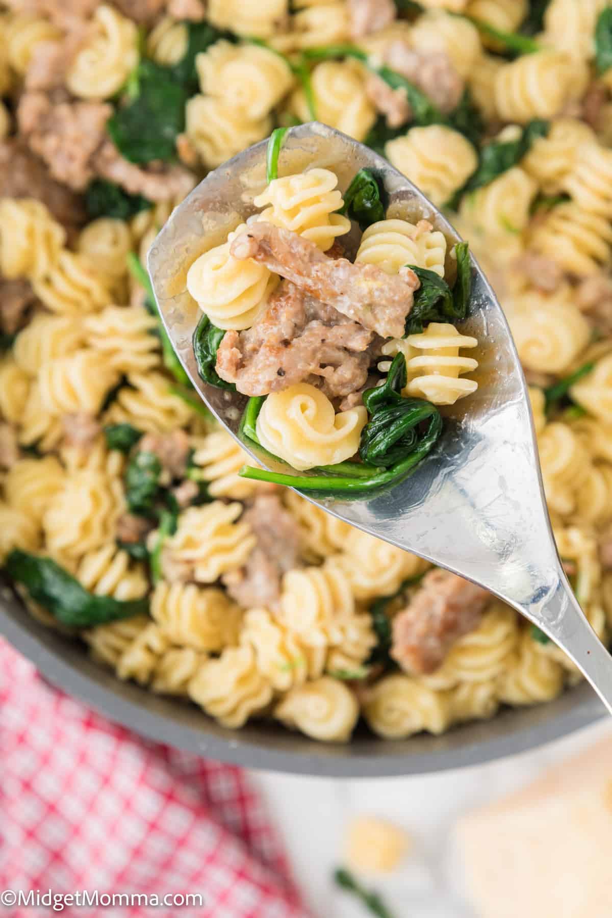 spoonful of Creamy Spinach Sausage Pasta
