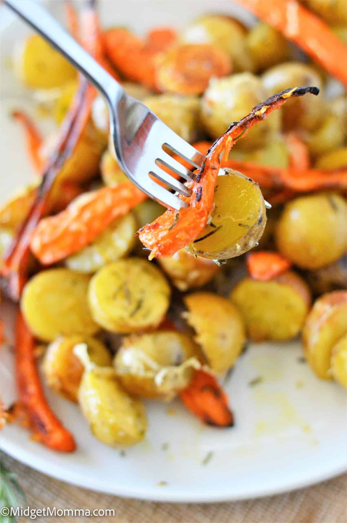 Rosemary Parmesan Roasted Carrots and Potatoes on a fork