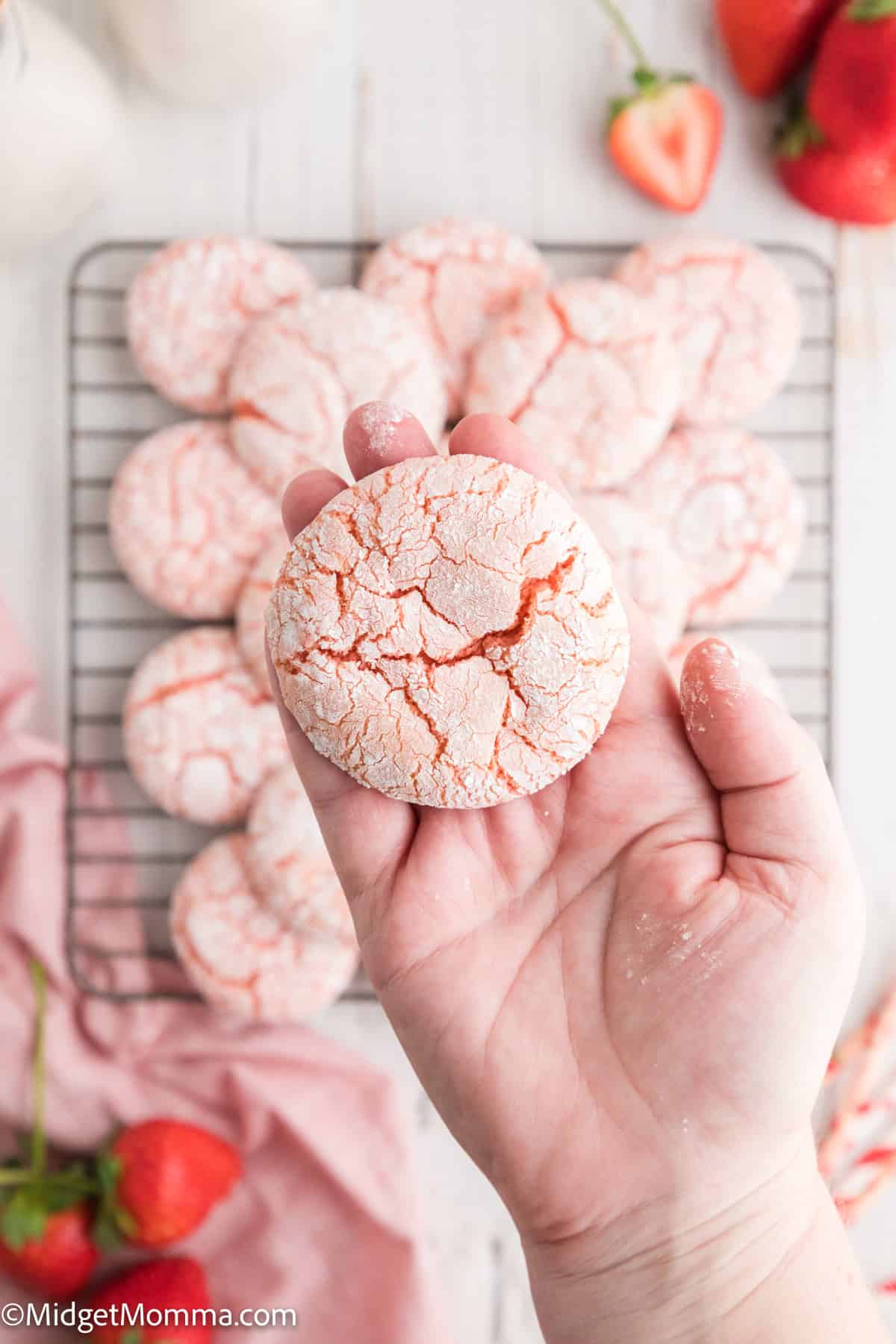 a hand holding a Strawberry Cake Mix Cookie