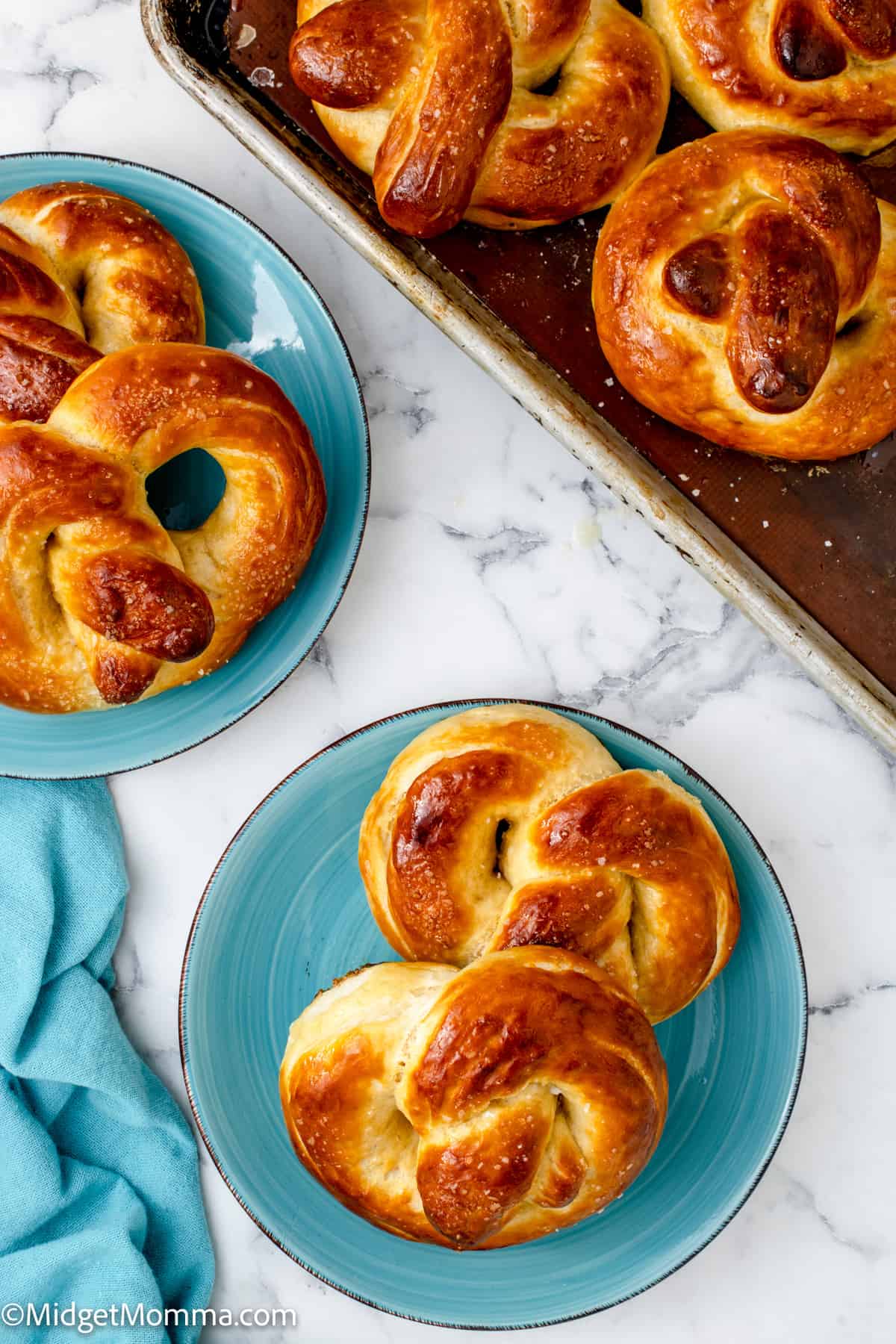 2 soft pretzels on a blue plate