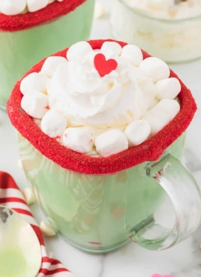 Grinch hot chocolate - grinch hot in a mug with marshmallows and whipped cream