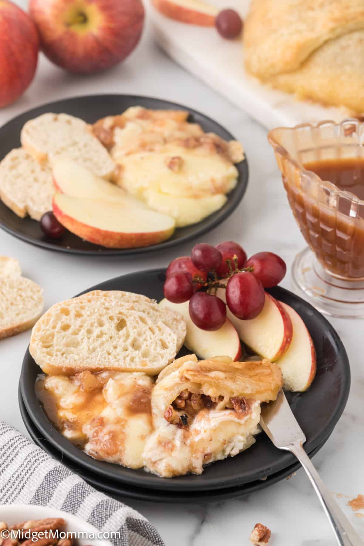plate full of slices of bread topped with Puff Pastry Baked Brie with Apples