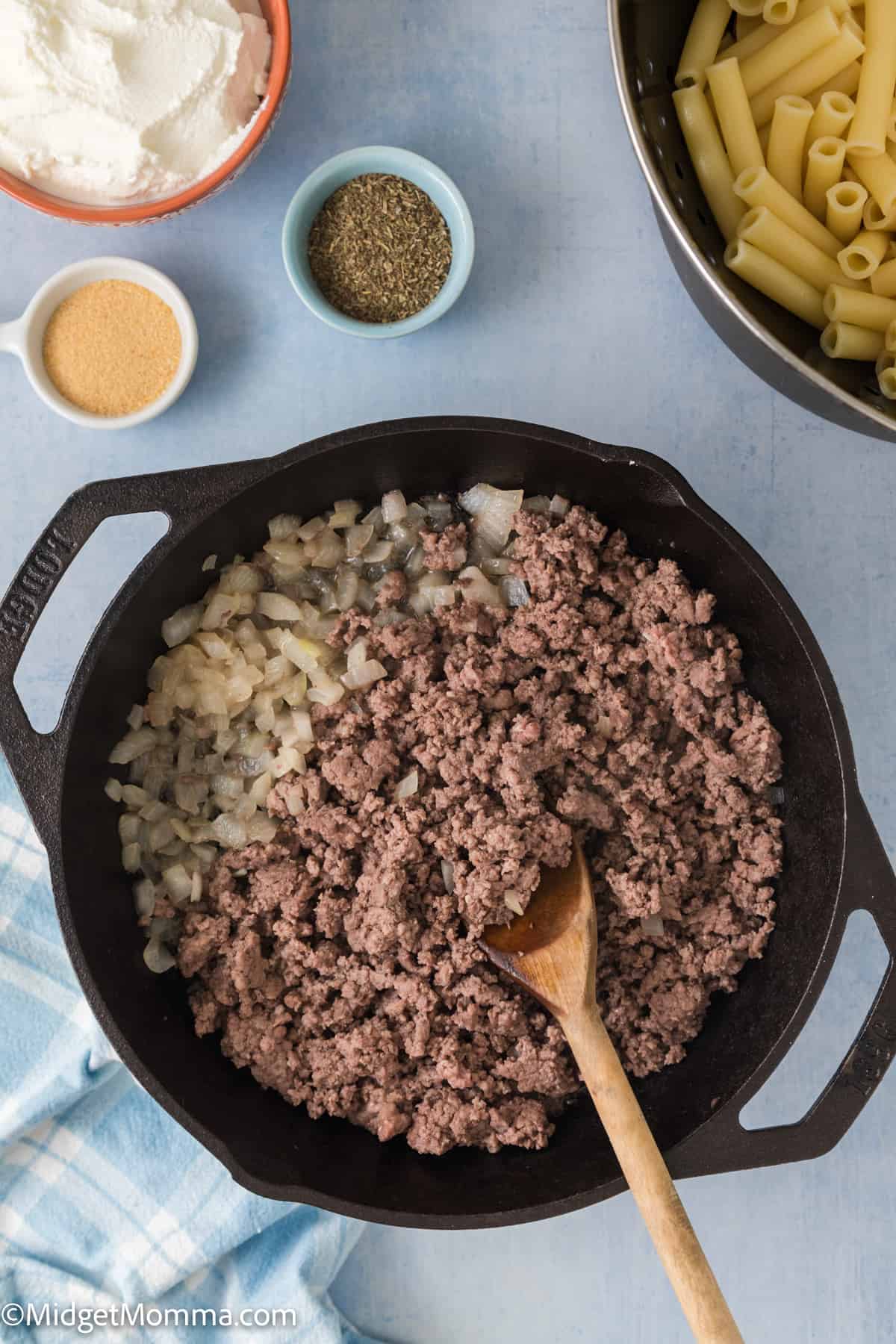 ground beef and cooked onion in a skillet