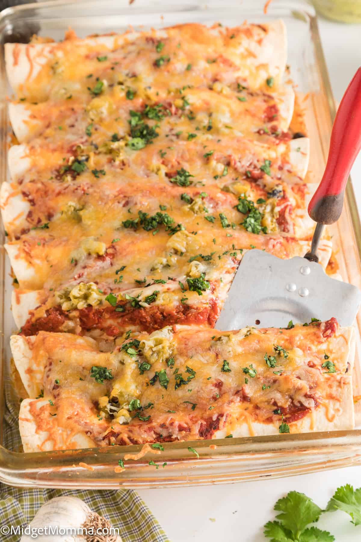 casserole dish filled with Cheesy Baked Beef Enchiladas