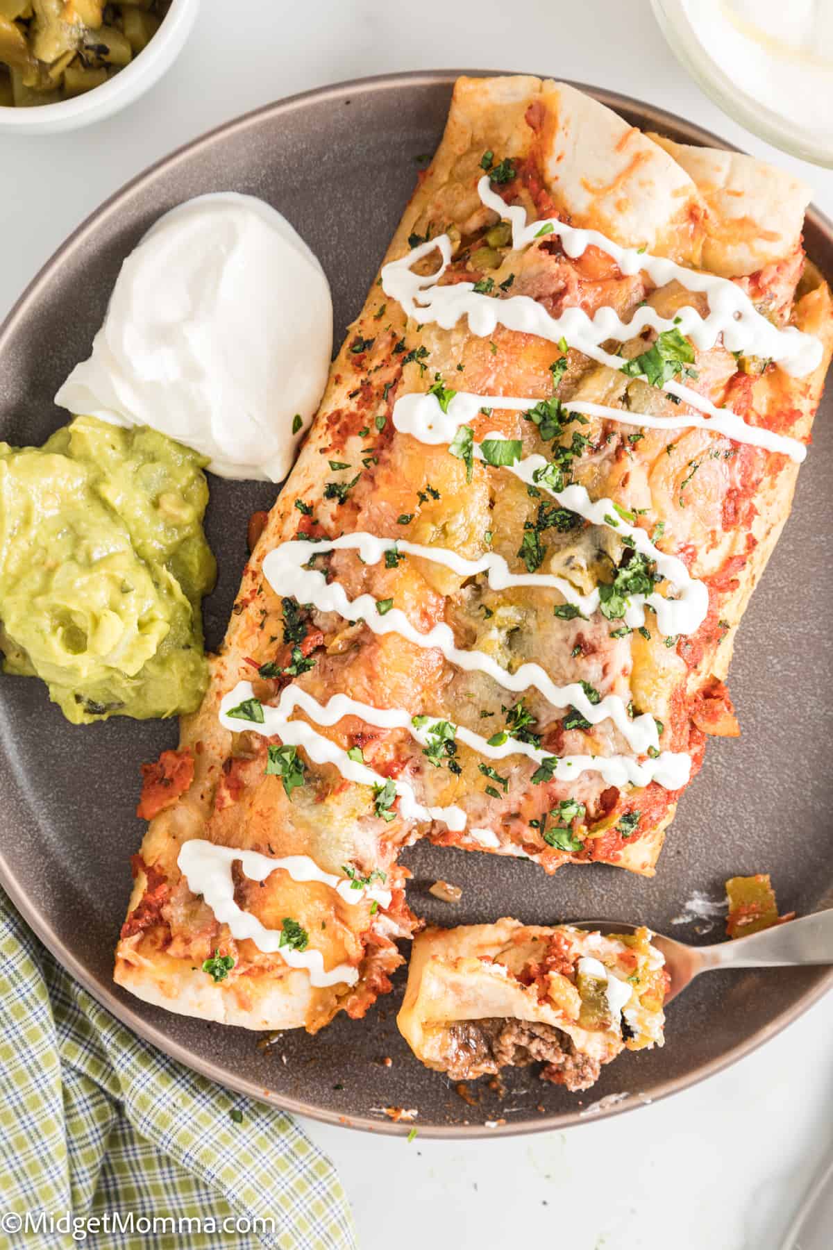 overhead photo of Cheesy Baked Beef Enchiladas on a plate
