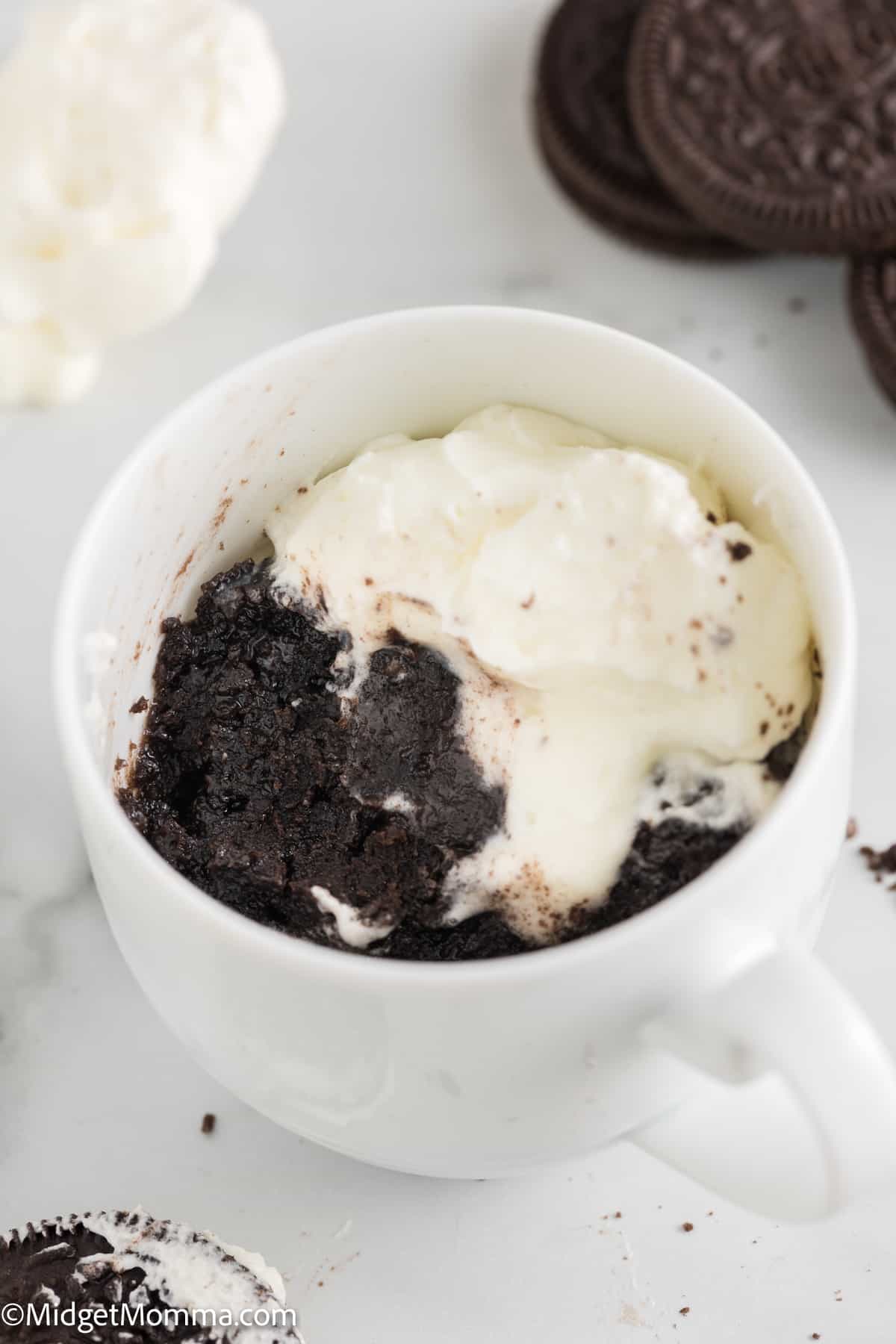 Microwave Oreo Mug Cake topped with whipped cream