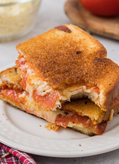 Pizza Grilled Cheese Sandwich Recipe with a bite out of a sandwich