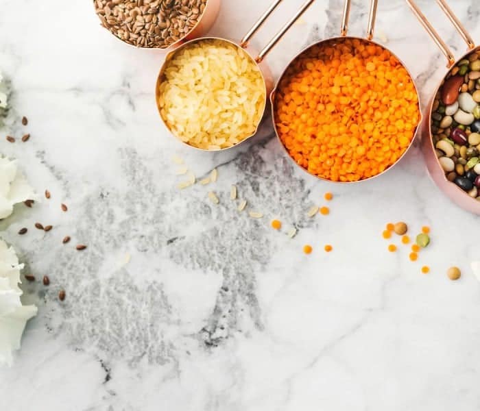 Measuring cups on marble counter.