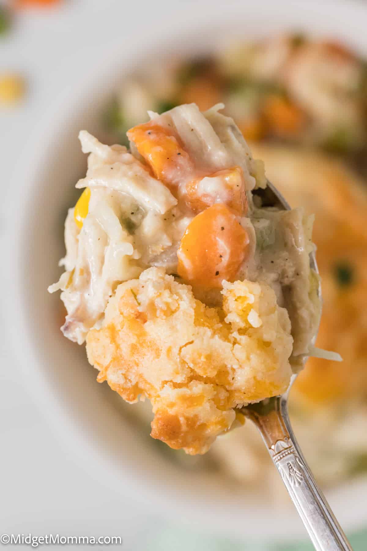 spoonful of Easy Chicken Pot Pie Casserole with Cheddar Drop Biscuit Topping