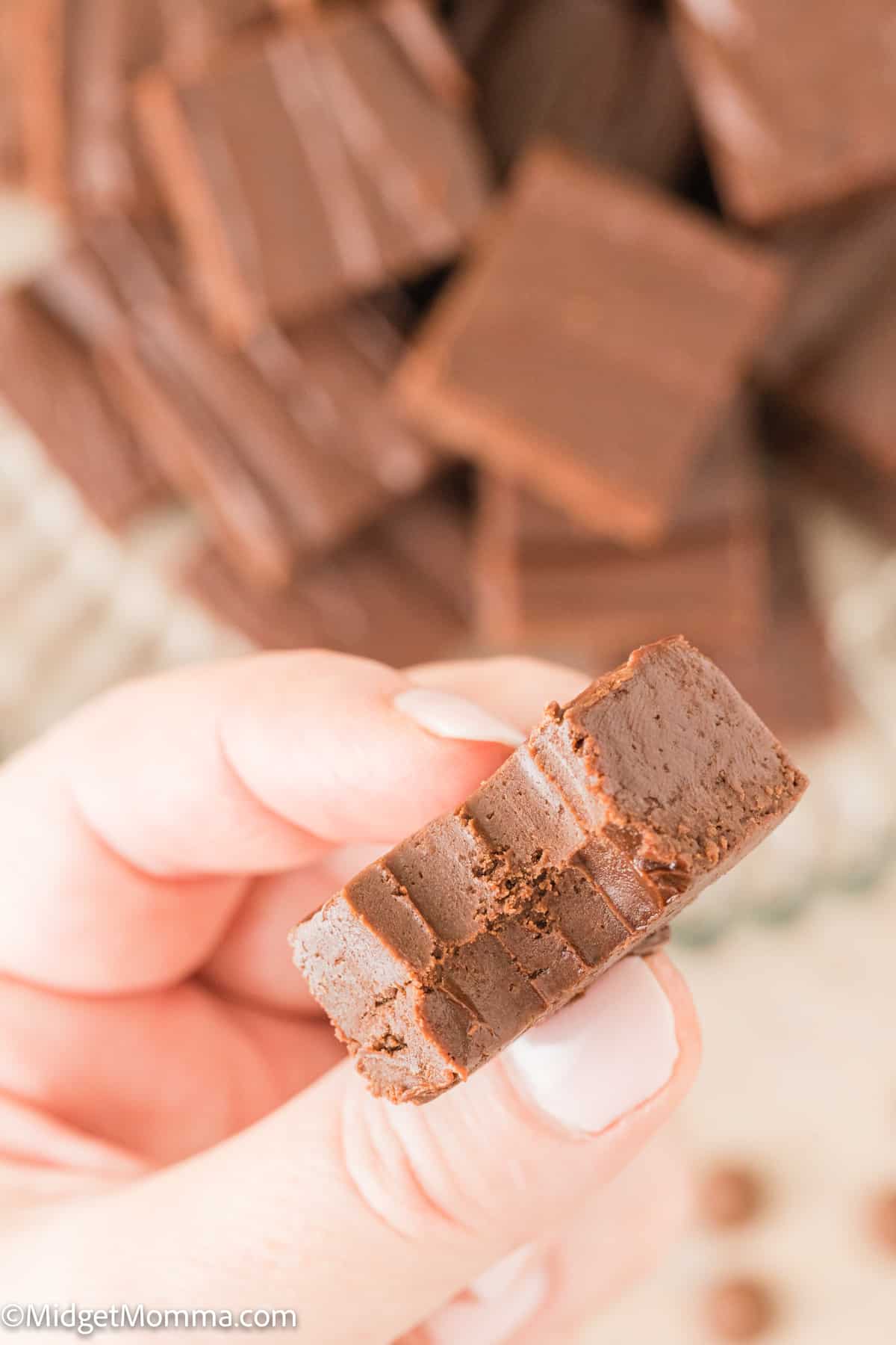 piece of Easy Two Ingredient Chocolate Microwave Fudge with a bite out of it
