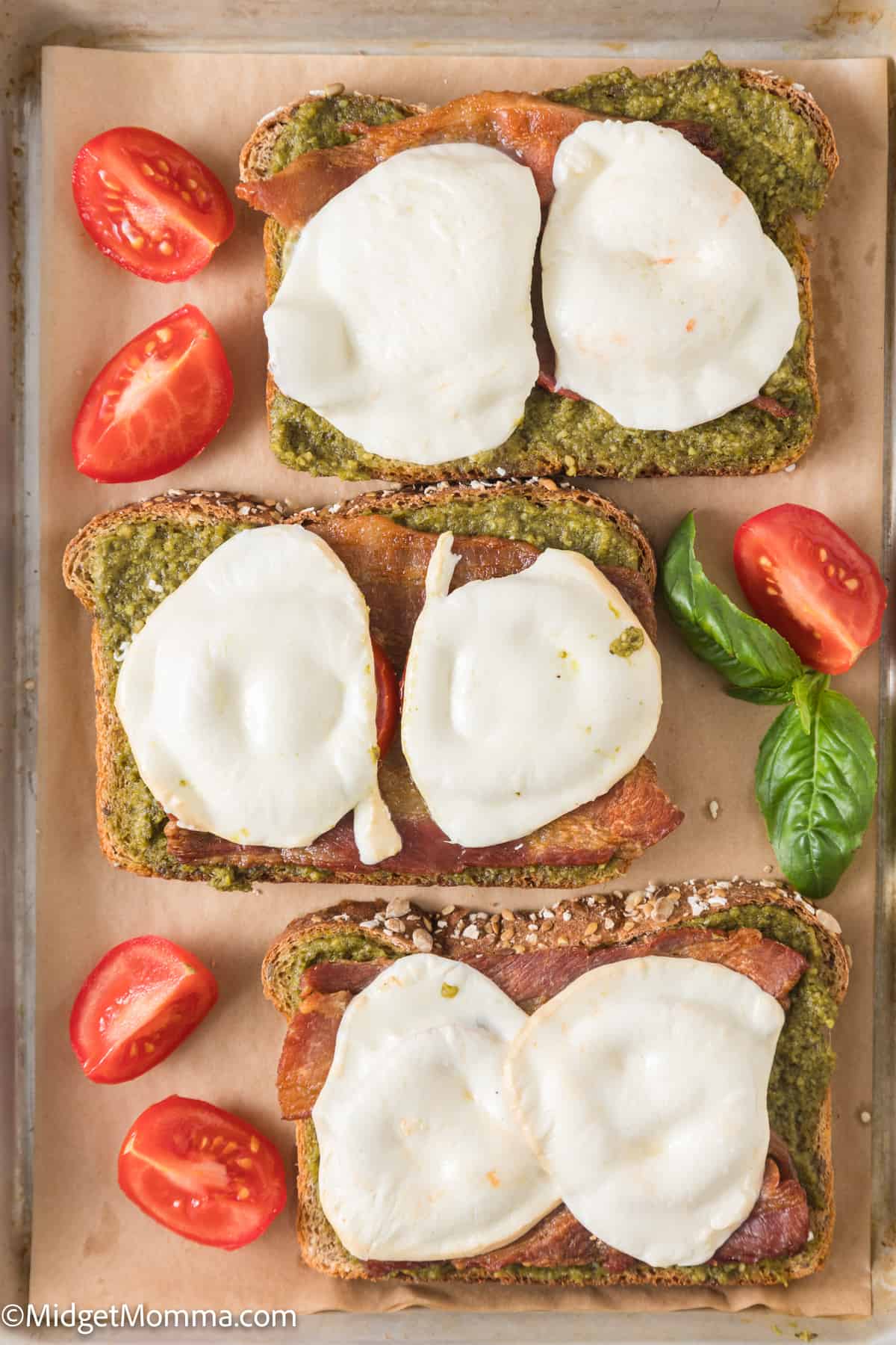 overhead photo of open-faced Pesto Grilled Cheese Sandwich Recipe with Mozzarella Cheese, Tomato & Bacon