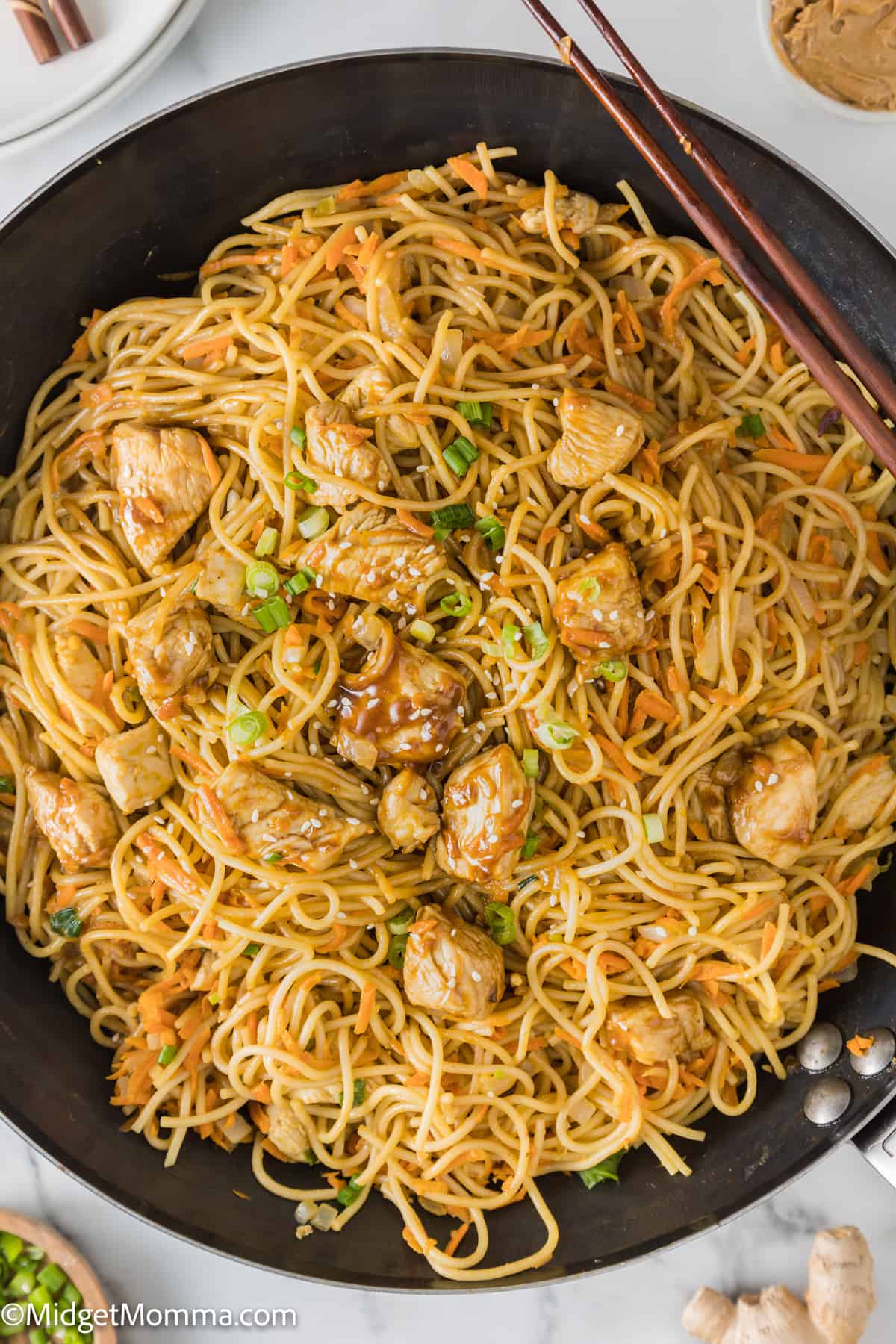 overhead photo of Thai Peanut Noodles with Chicken in a skillet done cooking