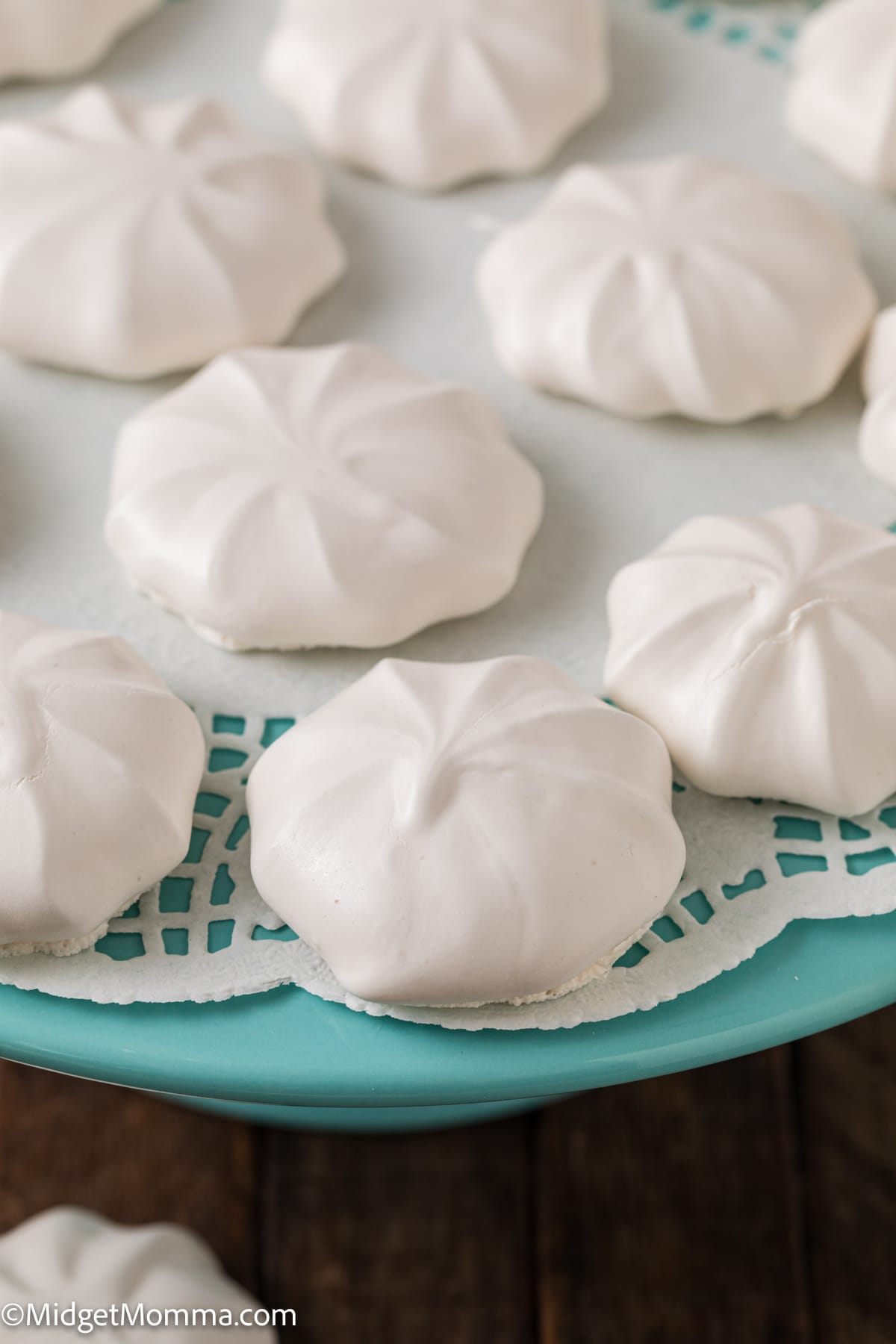 close up photo of vanilla meringue cookies on a plate