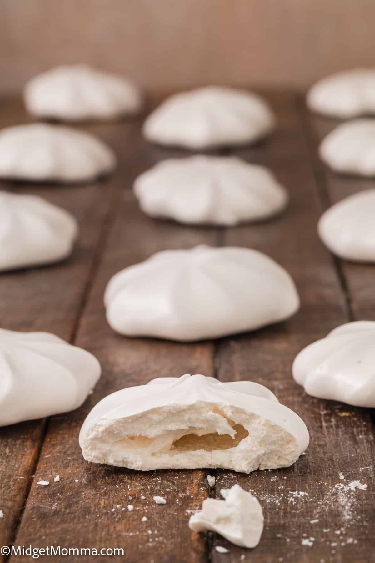 Vanilla Meringue Cookie with a bite taken out of it.