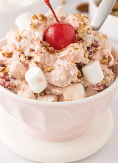 close up photo of a serving bowl filled with Cherry fluff