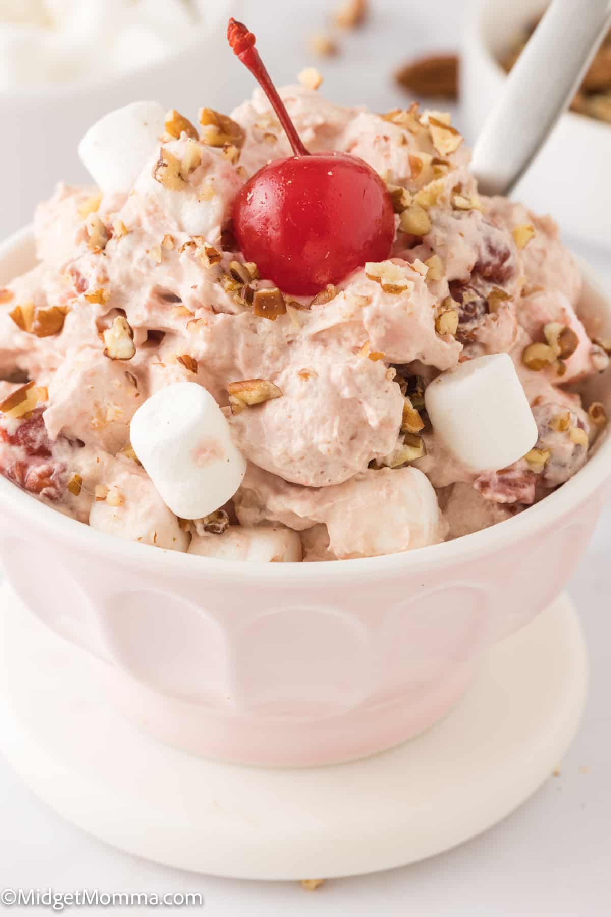 close up photo of a serving bowl filled with Cherry fluff