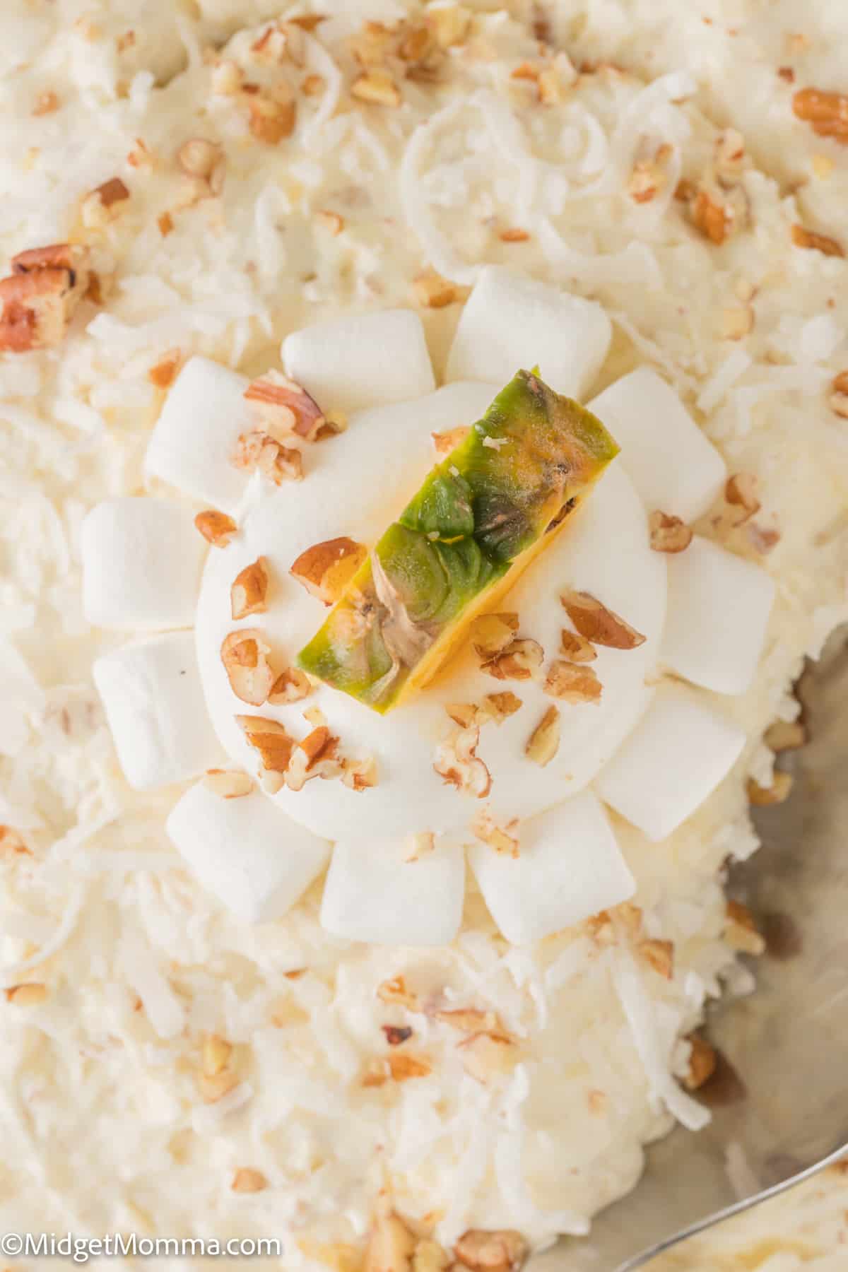 Close up overhead photo of a serving dish with pineapple fluff salad 