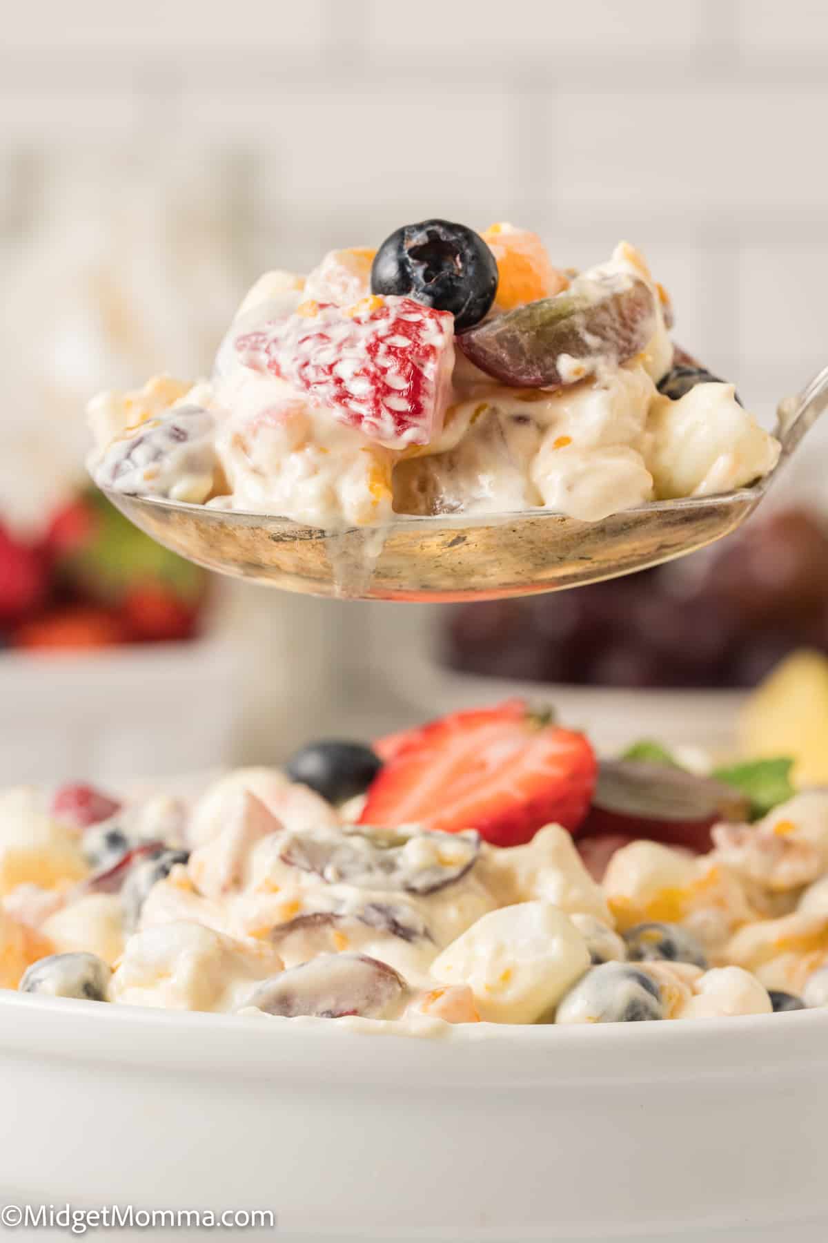 large spoonful of Vanilla Pudding Fruit Salad