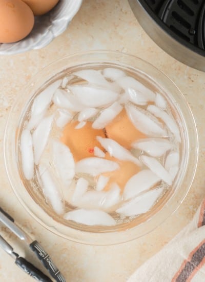 cooked hard boiled eggs in an ice bath
