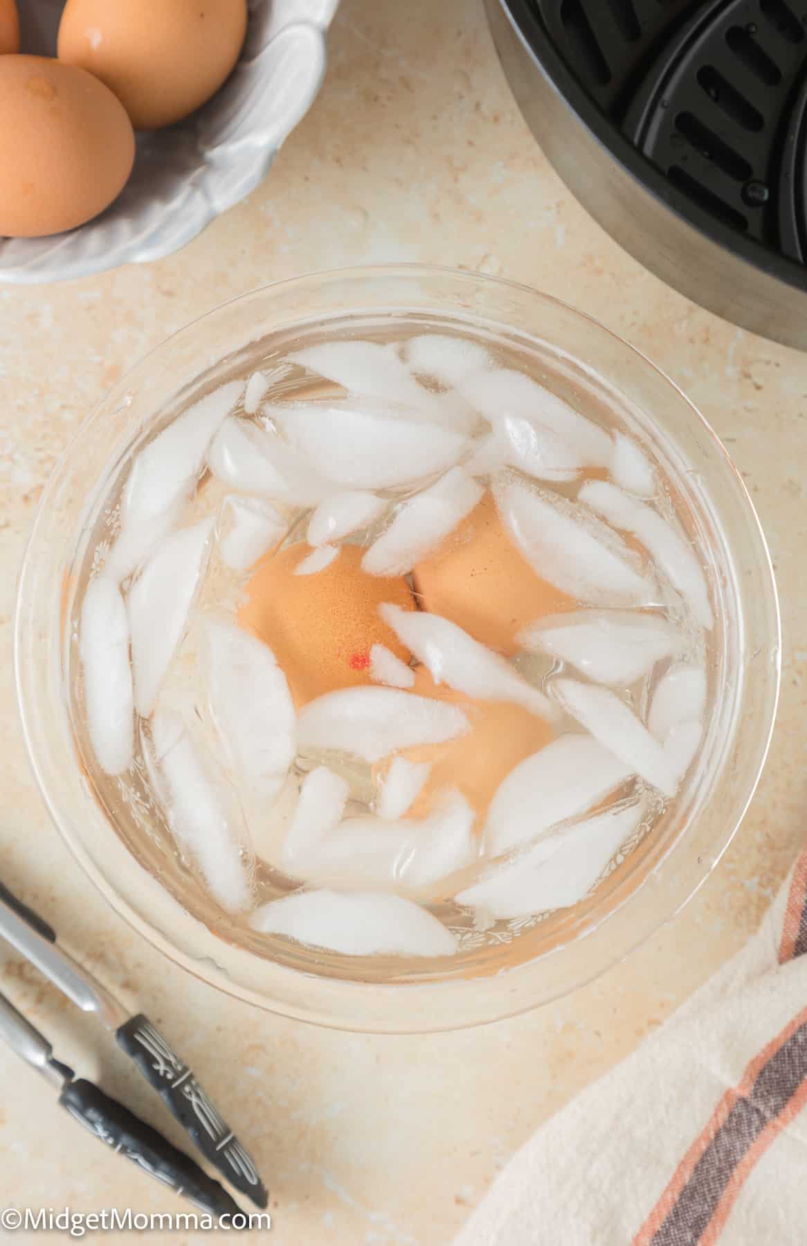 cooked air fryer eggs in an ice bath