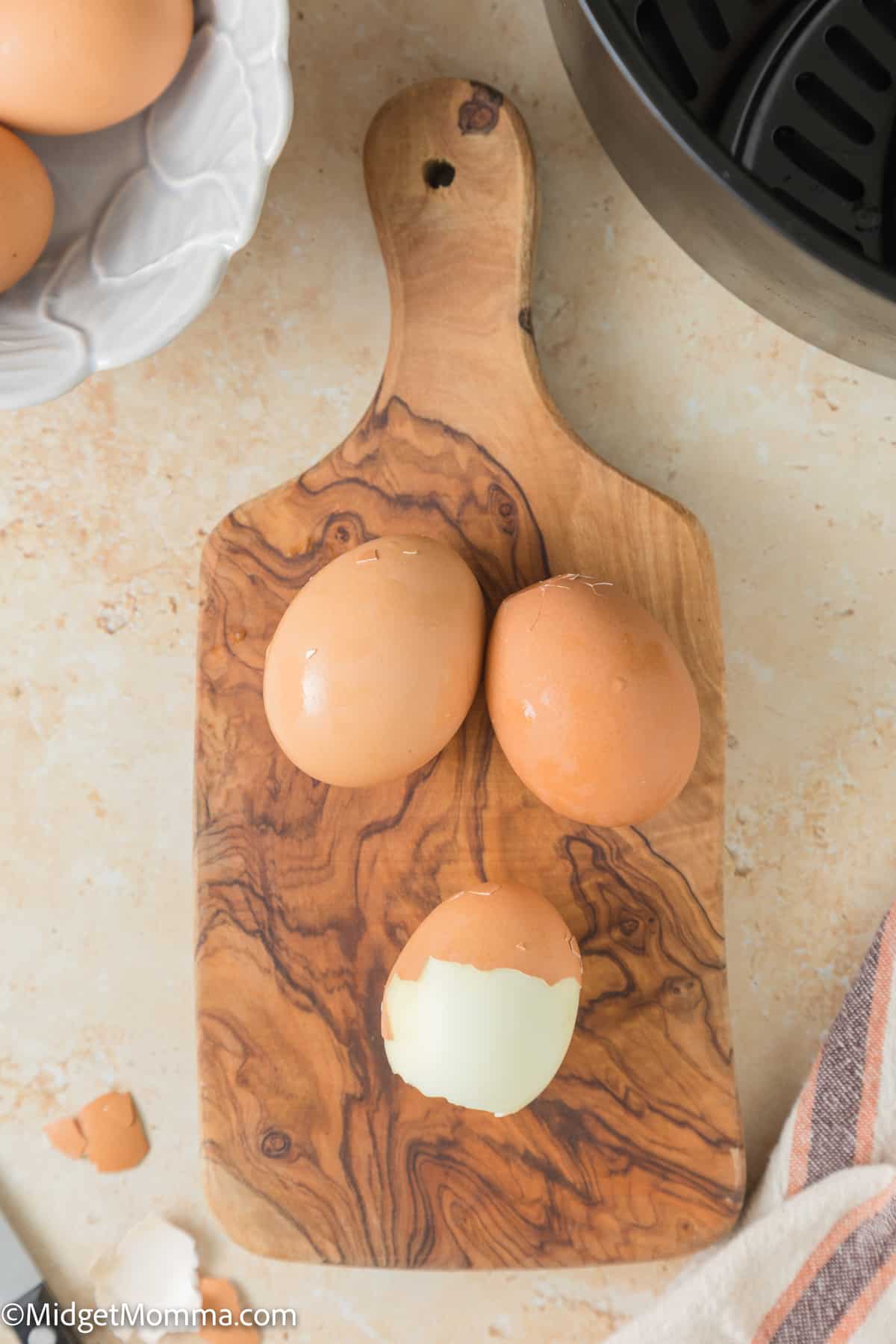 Eggs being peeled on a platter