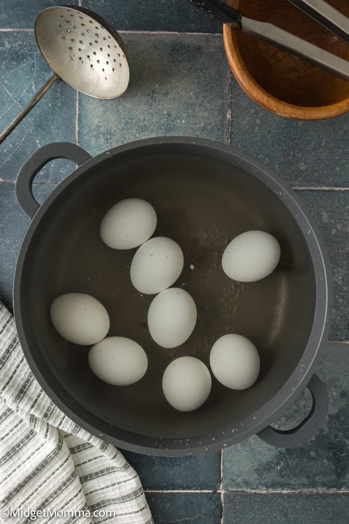 raw eggs in a pot of water